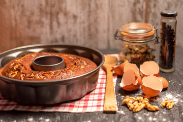 Grandma's homemade sponge cake, in a freshly made pan on a napkin with ingredients left over.