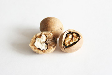 Walnuts on white table.  Food background with copyspace