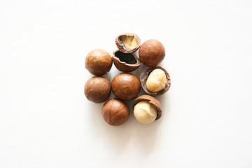 Macadamia nut  on white background with copyspace. Natural background of macadam nuts