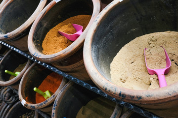 Buying local colorful spices in the open market in India.