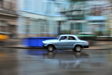 Fototapeta na wymiar Old car on the move in Cuba