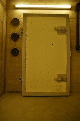 heavy bunker door in a basement