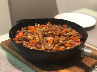 frying pan with meat and vegetables
