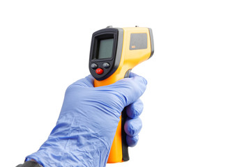 Closeup hand in a blue medical glove holds an digital infrared thermometer. Isolated on white...