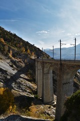 Railway viaduct in the mountains of the Valais in autumn