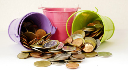 coins spilling out of bucket. stack coin concept save money