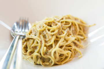 spaghetti carbonara in white on dinner table