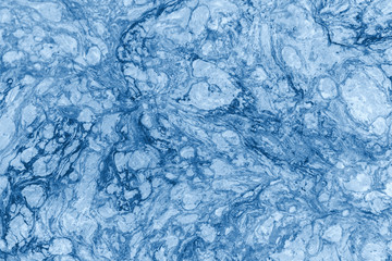 Abstract textured tinted classic blue color surface texture rough background, cement concrete floor or wall. The image is tinted in the color of the 2020 year-classic blue.