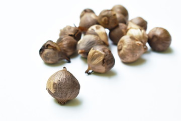 black garlic healthy food arranging on white background