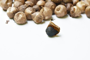 black garlic healthy food arranging on white background