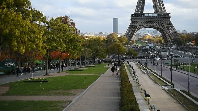 Tourists are seen on a beautiful autumn day in Trocadero gardens in Paris.