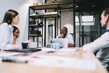 Thoughtful man during work negotiation with colleagues