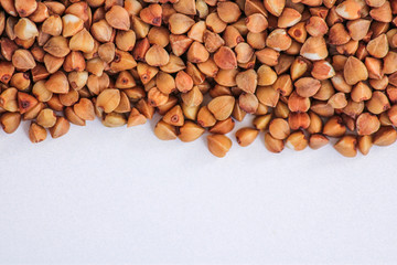 Buckwheat groats background. Close up. Macro. Healthy food, diet, veg, natural product. Horizontal