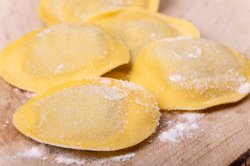 raw italian tortelli pasta with flour