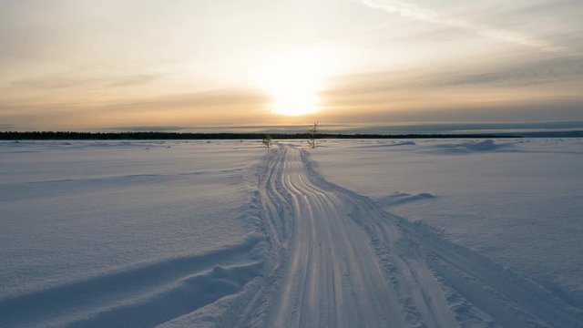 Scenic winter landscape of snowy road across the frozen river Yenisei in Siberia. Russia. 4K