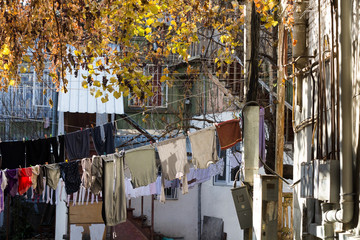 Tbilisi city yard with clothes on the ropes