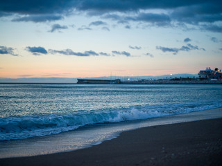 Calm waves on a beach at dawn