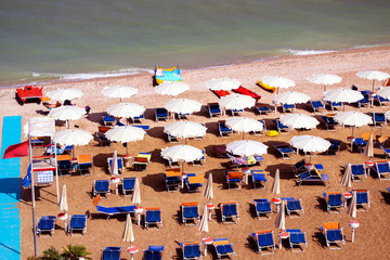 aerial view of parasols and beachline in Marotta. For travel and holiday concepts