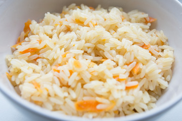 Rice with vegetables on a white background