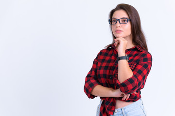 Fototapeta premium Young beautiful hipster woman thinking and looking up
