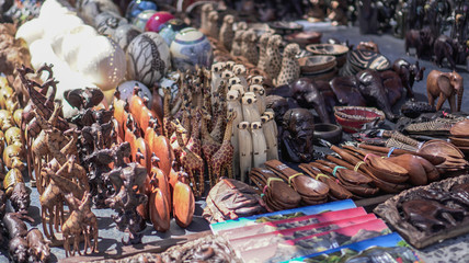 Africa meerkat and cheetah wood craft handicraft souvenir of South Africa sell in city bazaar