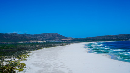 Fototapeta na wymiar Blue ocean and white sand of South Africa beach tropical beach vacation scene