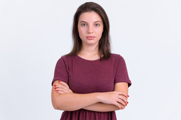 Fototapeta premium Portrait of young beautiful woman with arms crossed