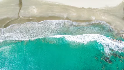 Zelfklevend Fotobehang Emerald green sea and white shore.  Shoot with a drone from the sky © Tomoko