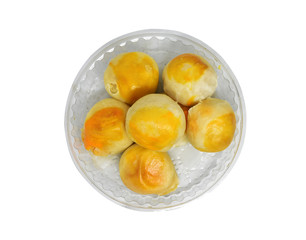 Chinese pastry or moon cake filled with mung bean paste and salted egg yolk isolated on white background. Clipping path