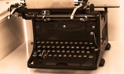 View of an antique manual Underwood typewriter on sepia