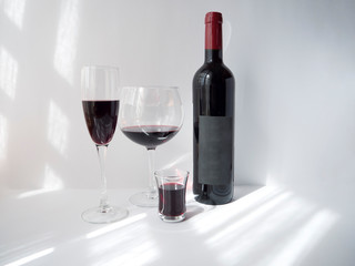 Red wine in a glass on white background