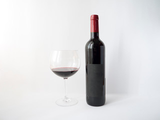 Red wine in a glass on white background