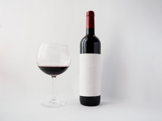 Red wine in a glass on white background