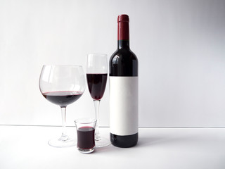 Red wine in a glass on white background