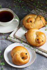 Traditional spring bird-shaped lean buns coated with sweet syrup.