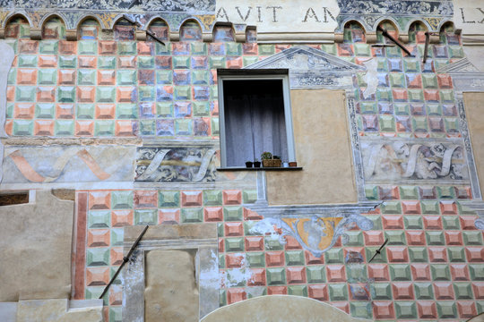 Finalborgo (SV), Italy - December 12, 2017: A painted wall on a house in Finalborgo village, Finale Ligure, Liguria, Italy