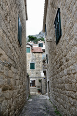 Mediterranean cozy deserted stone walk street in Dalmatia, Omis, Croatia, Europe