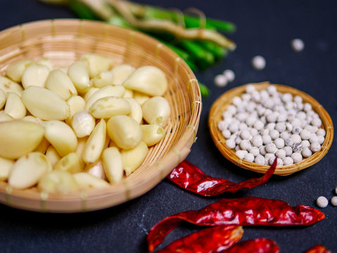 classic Siam cuisine style concept : Thai spice preparing to cook garlic , dry pepper and coriender roots 