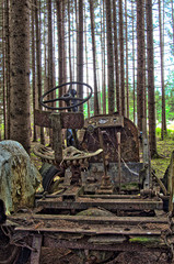 abandoned old tractor in the forest