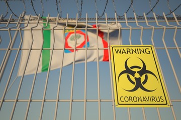 Coronavirus warning sign on the barbed wire fence near flag of Apulia, a region of Italy. COVID-19 quarantine related 3D rendering