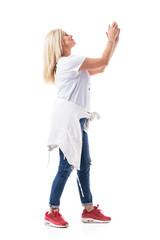 Side view of middle age woman mother applauding and clapping hands cheering and supporting. Full...