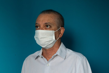Recife / Pernambuco / Brazil. March, 20, 2020. Images of a 54-year-old middle-aged male model wearing protective hospital masks and gloves. Protection against Covid-19.