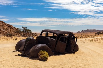 A Bullet-ridden Hudson Terraplane 1934 car in Namibian desert