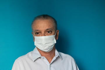 Recife / Pernambuco / Brazil. March, 20, 2020. Images of a 54-year-old middle-aged male model wearing protective hospital masks and gloves. Protection against Covid-19.