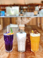 Milk tea, butterfly pea and orange juice.
