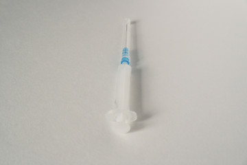 Syringe on a white background, disease, treatment