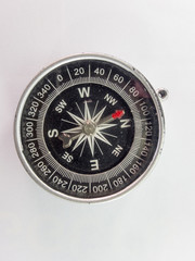 Black compass on a white background.