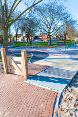 an exercise park. In the park, wheelchair users, walker users and elderly people with walking difficulties can go to exercise. different pavement on the ground. zeewolde netherlands flevoland 21 March