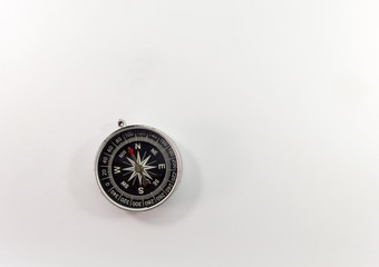 Black compass on a white background.