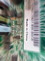 Electronic circuits are made of blurred characters that are made in China.